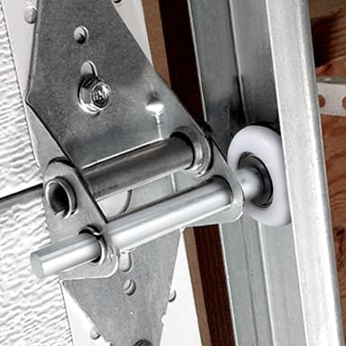 Garage door roller serviced during a Broward 25-point tune-up